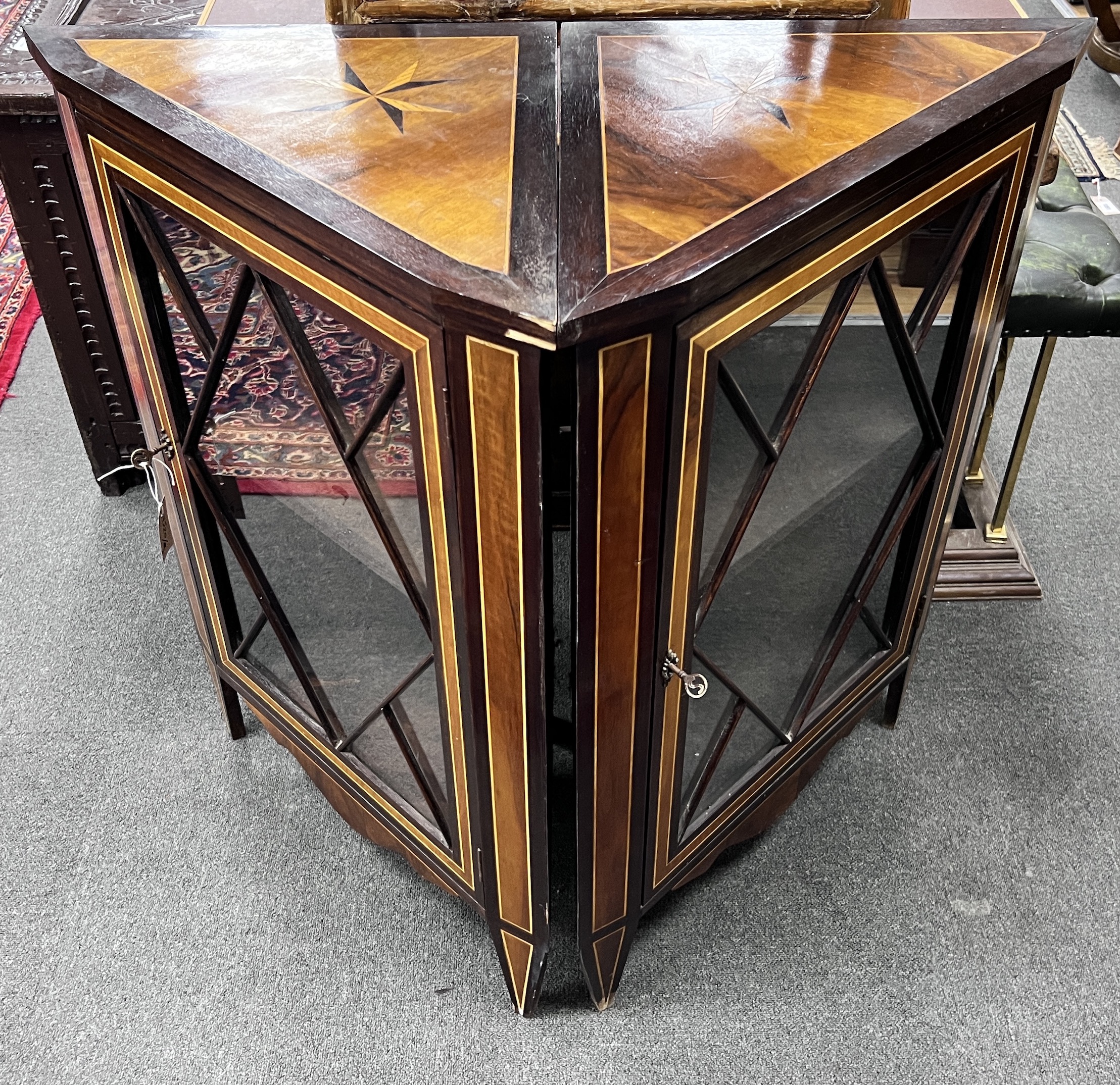 A pair of 19th century Dutch inlaid and stained beech corner cabinets, each set with a Maltese Cross to the top, width 67cm, height 92cm